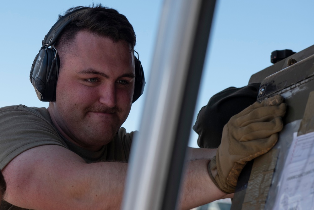 Marine C-130 at Creech; loading equipment and Airmen