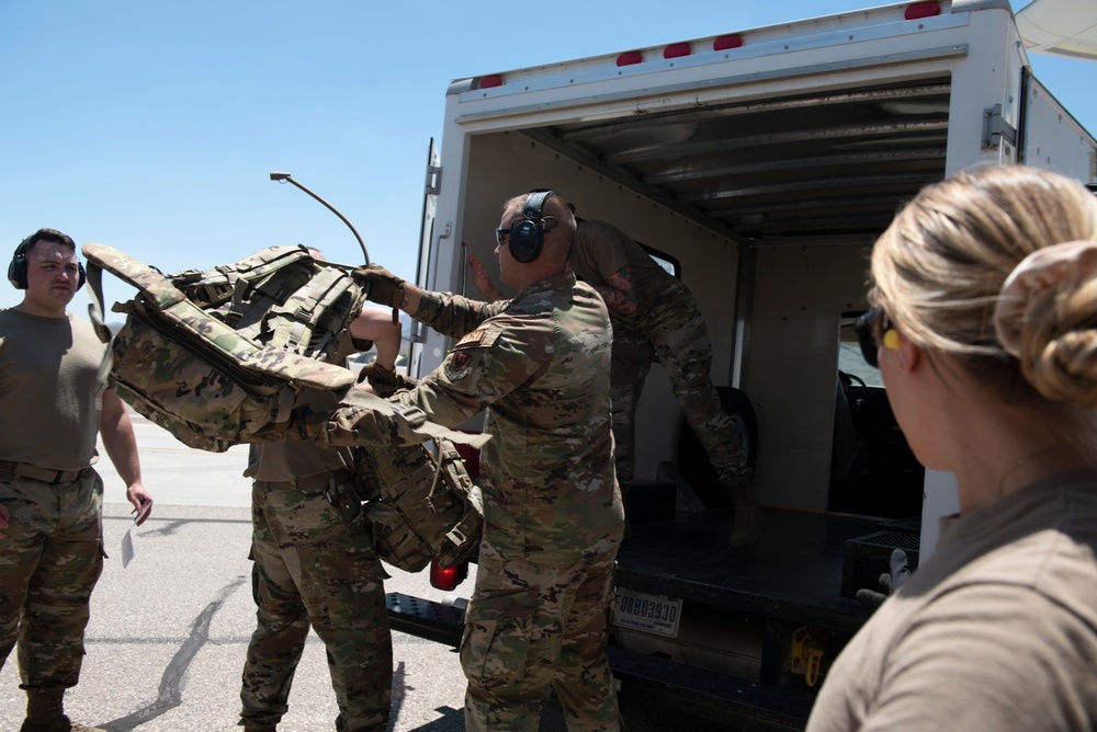 Marine C-130 at Creech; loading equipment and Airmen