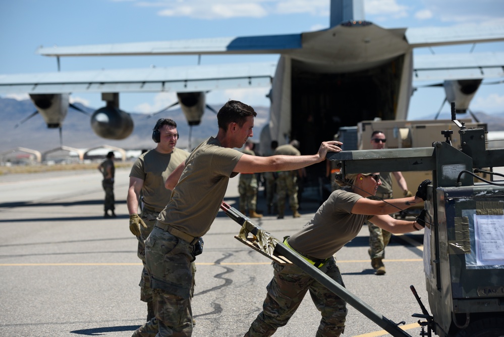 Marine C-130 at Creech; loading equipment and Airmen