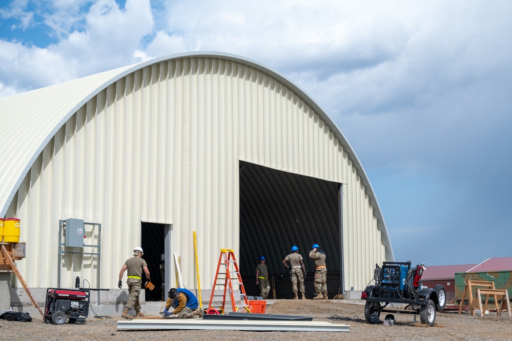 131st CES trains with 819th and 219th RHS building M1 Abrams storage facility