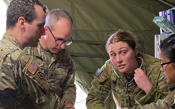 Soldiers of the 144th Area Support Company, Utah Army National Guard, conduct medical emergency scenario training with the 3rd Health Battalion, Australian Defense Force, during Talisman Sabre 2023