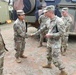 Command Sgt. Maj. Jonathan Dehart of the 311th Signal Command congratulates soldier