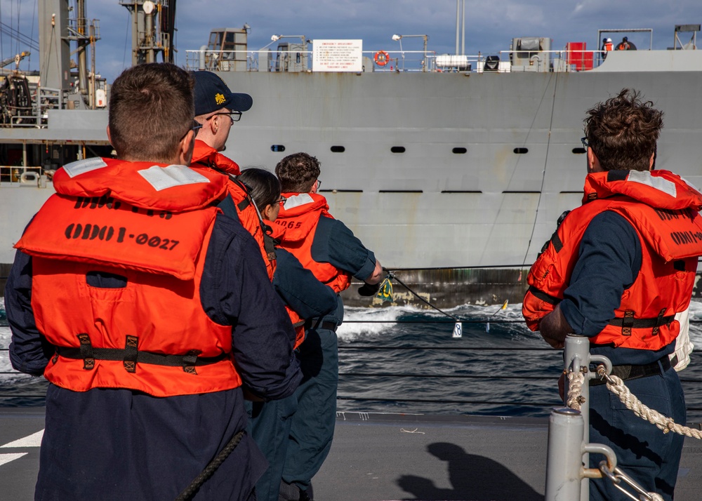 USS Rafael Peralta (DDG 115) conducts a replenishment-at-sea with the Military Sealift Command fleet replenishment oiler USNS Tippecanoe (T-AO 199)