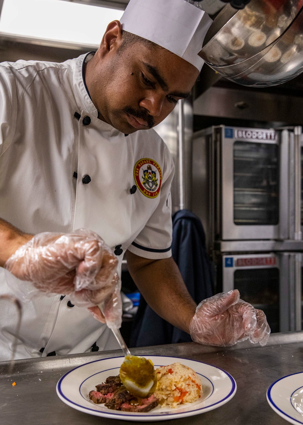 USS Rafael Peralta (DDG 115) conducts a July birthday meal celebration