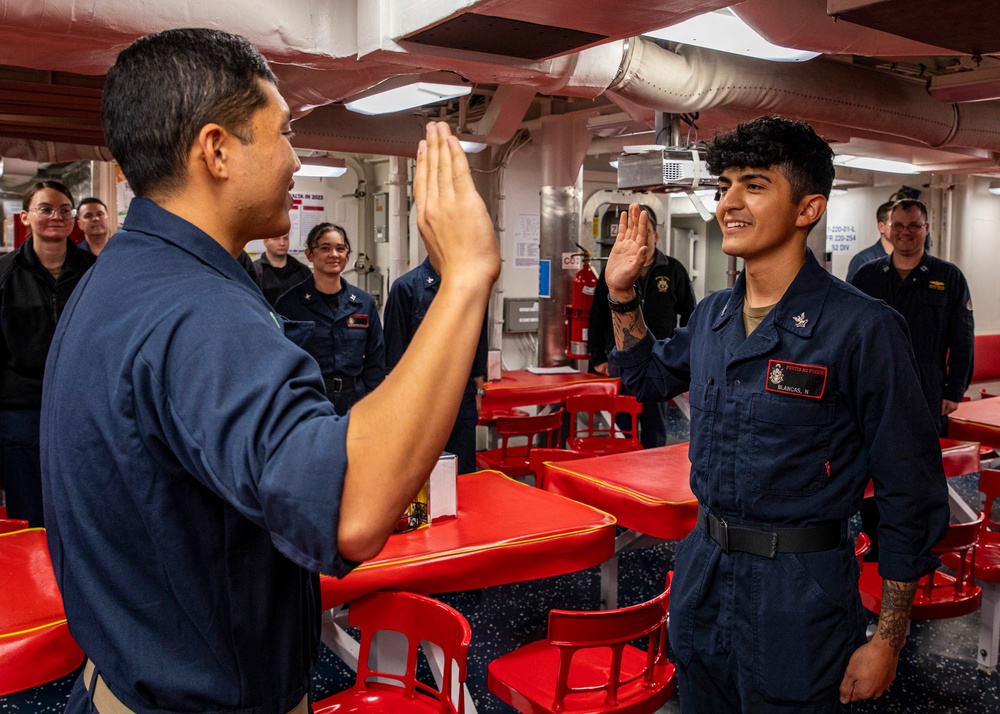 USS Rafael Peralta (DDG 115) conducts a reenlistment ceremony on the mess decks