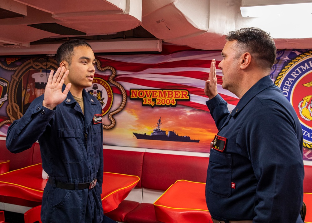 USS Rafael Peralta (DDG 115) conducts a reenlistment ceremony on the mess decks