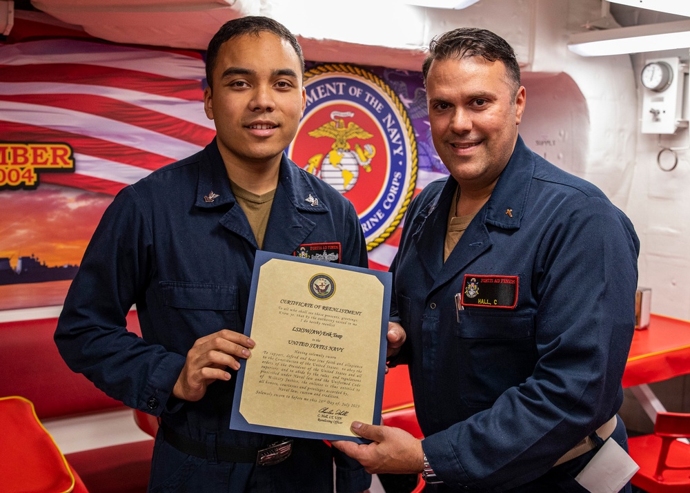 USS Rafael Peralta (DDG 115) conducts a reenlistment ceremony on the mess decks