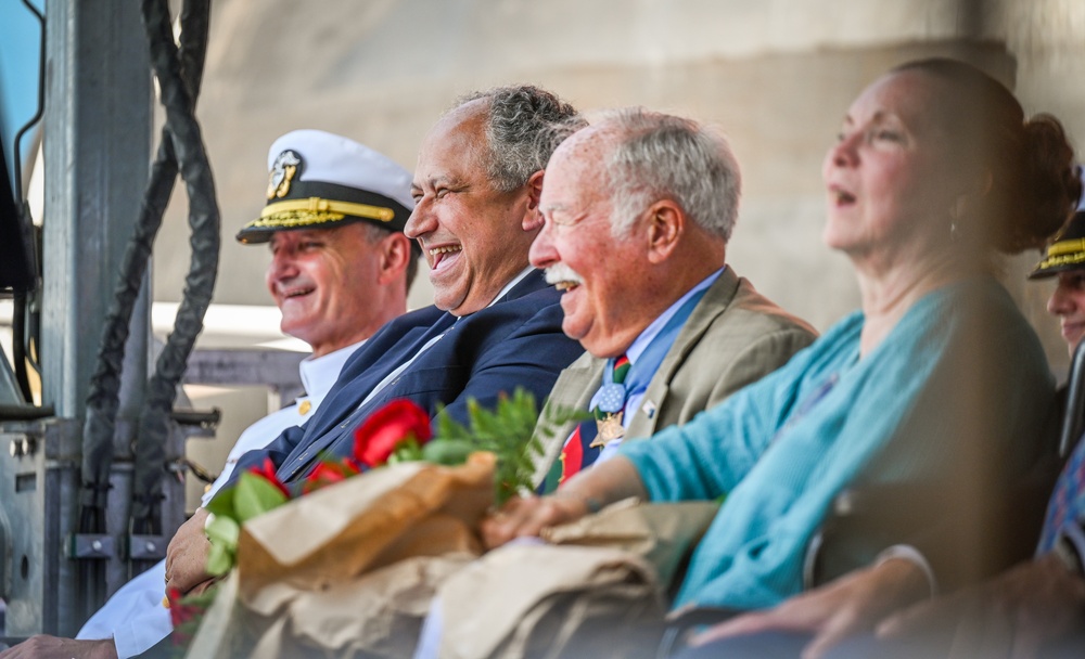 Secretary of the Navy Carlos Del Toro delivers remarks during the christening ceremony of USS Harvey C. Barnum Jr. (DDG 124)