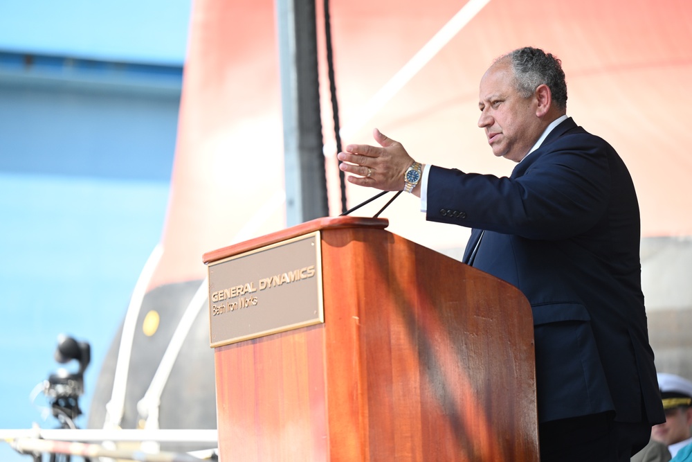 Secretary of the Navy Carlos Del Toro delivers remarks during the christening ceremony of USS Harvey C. Barnum Jr. (DDG 124)