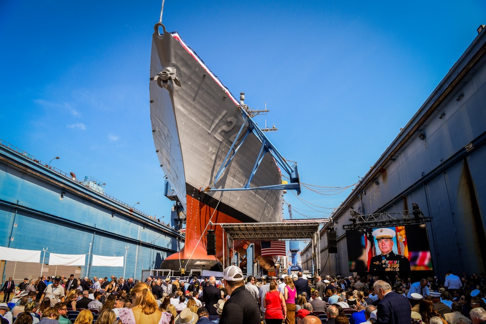 Secretary of the Navy Carlos Del Toro delivers remarks during the christening ceremony of USS Harvey C. Barnum Jr. (DDG 124)