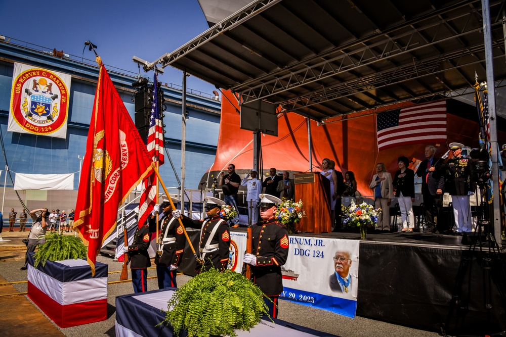 Secretary of the Navy Carlos Del Toro delivers remarks during the christening ceremony of USS Harvey C. Barnum Jr. (DDG 124)