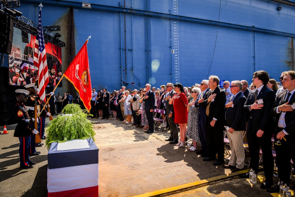 Secretary of the Navy Carlos Del Toro delivers remarks during the christening ceremony of USS Harvey C. Barnum Jr. (DDG 124)