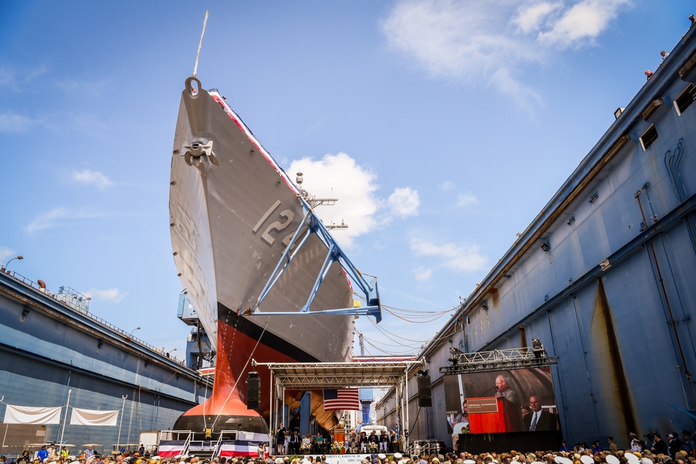 Secretary of the Navy Carlos Del Toro delivers remarks during the christening ceremony of USS Harvey C. Barnum Jr. (DDG 124)