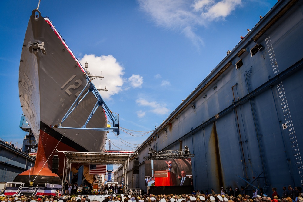 Secretary of the Navy Carlos Del Toro delivers remarks during the christening ceremony of USS Harvey C. Barnum Jr. (DDG 124)