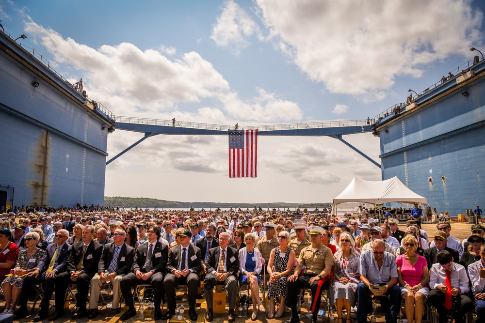 Secretary of the Navy Carlos Del Toro delivers remarks during the christening ceremony of USS Harvey C. Barnum Jr. (DDG 124)