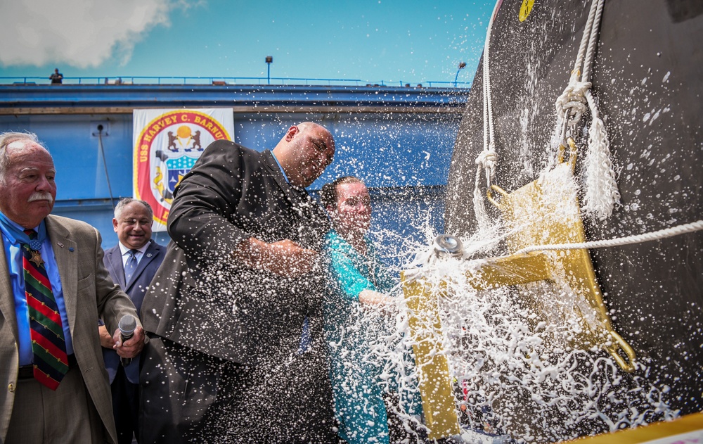 Secretary of the Navy Carlos Del Toro delivers remarks during the christening ceremony of USS Harvey C. Barnum Jr. (DDG 124)