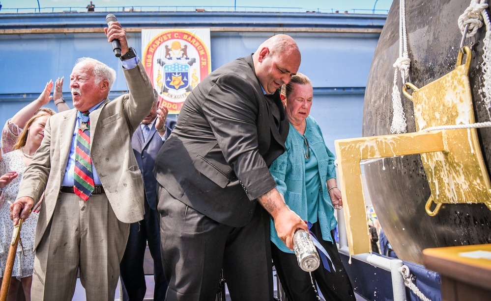 Secretary of the Navy Carlos Del Toro delivers remarks during the christening ceremony of USS Harvey C. Barnum Jr. (DDG 124)