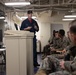 Rear Admiral Stone briefs SNCOs aboard USS America