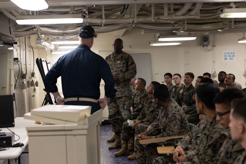 Rear Admiral Stone briefs SNCOs aboard USS America