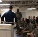 Rear Admiral Stone briefs SNCOs aboard USS America