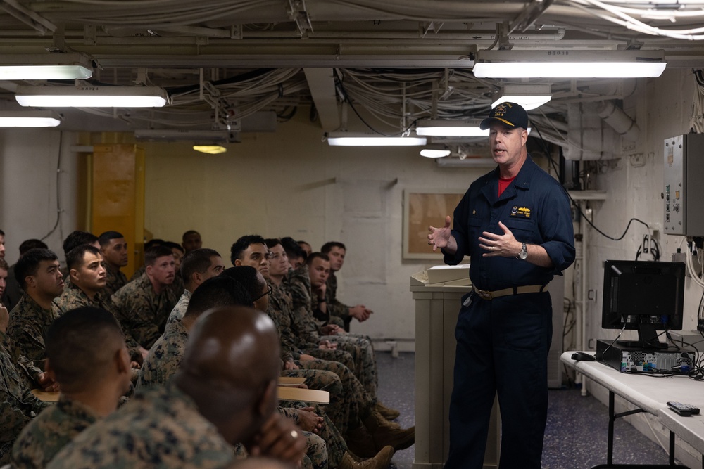 Rear Admiral Stone briefs SNCOs aboard USS America