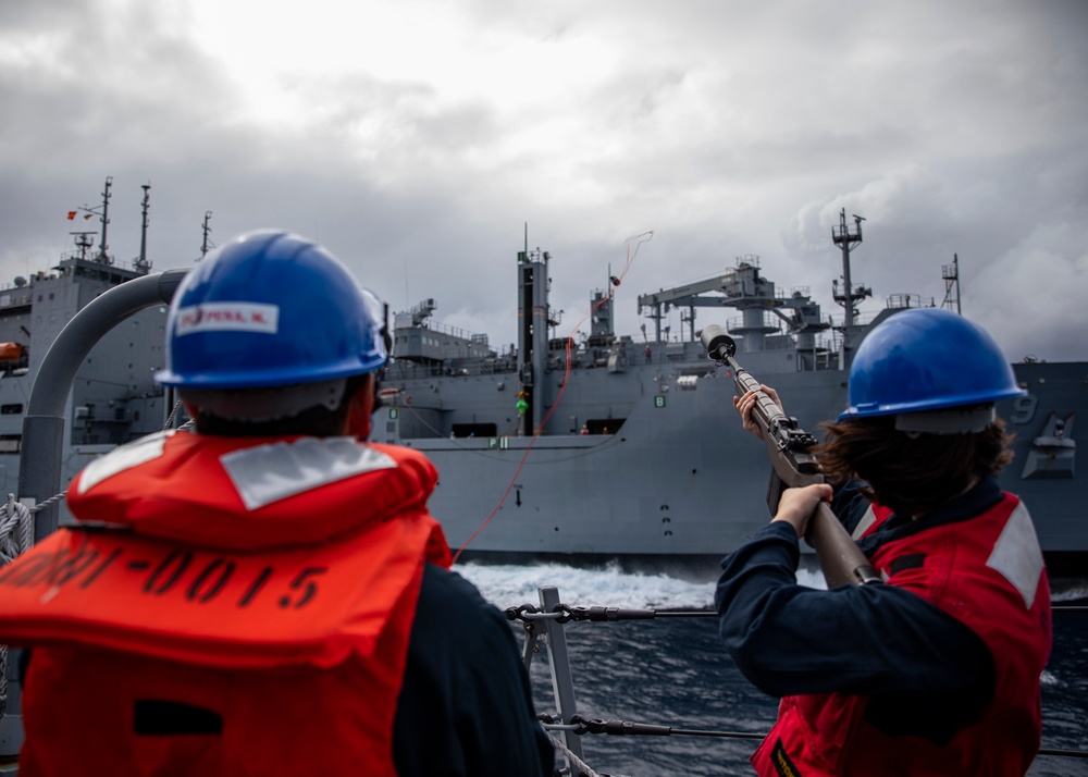 USS Rafael Peralta (DDG 115) conducts a replenishment-at-sea with the Military Sealift Command fleet replenishment oiler USNS Matthew Perry (T-AKE 9)