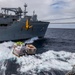 USS Rafael Peralta (DDG 115) conducts a replenishment-at-sea with the Military Sealift Command fleet replenishment oiler USNS Matthew Perry (T-AKE 9)