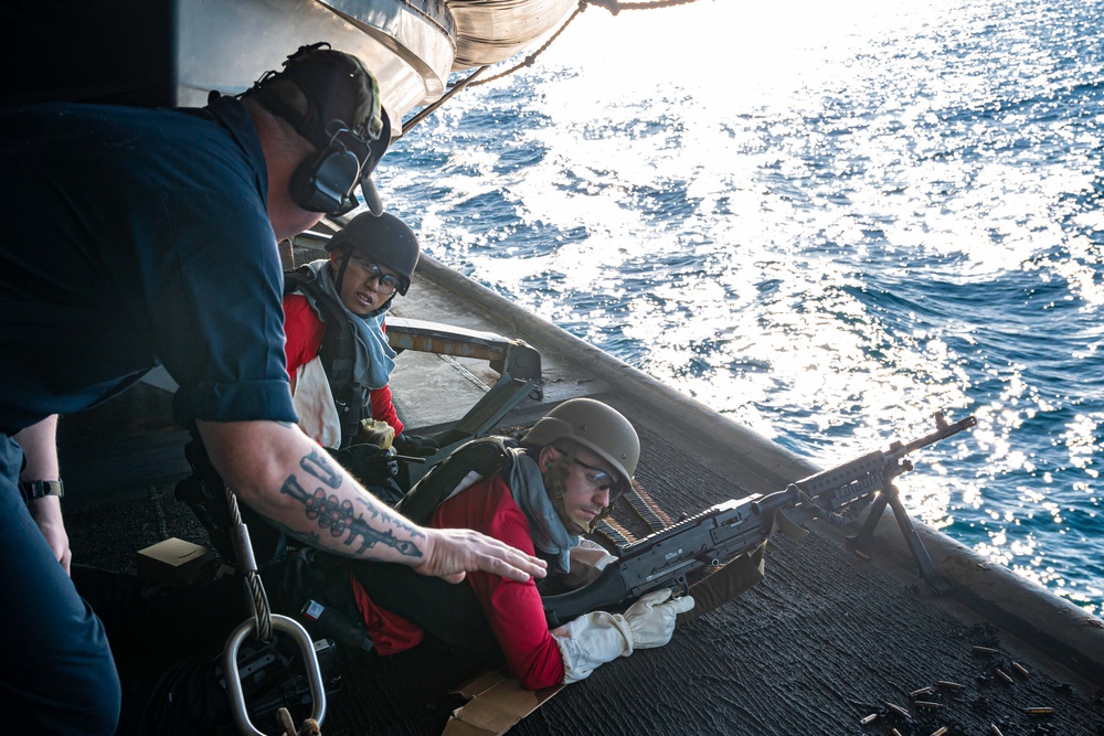 USS Ronald Reagan (CVN 76) Sailors participate in live fire exercise