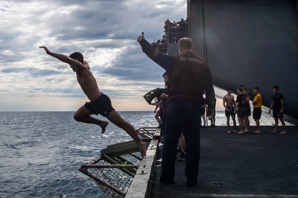 USS Ronald Reagan (CVN 76) celebrates the 20th anniversary of its commissioning with a swim call