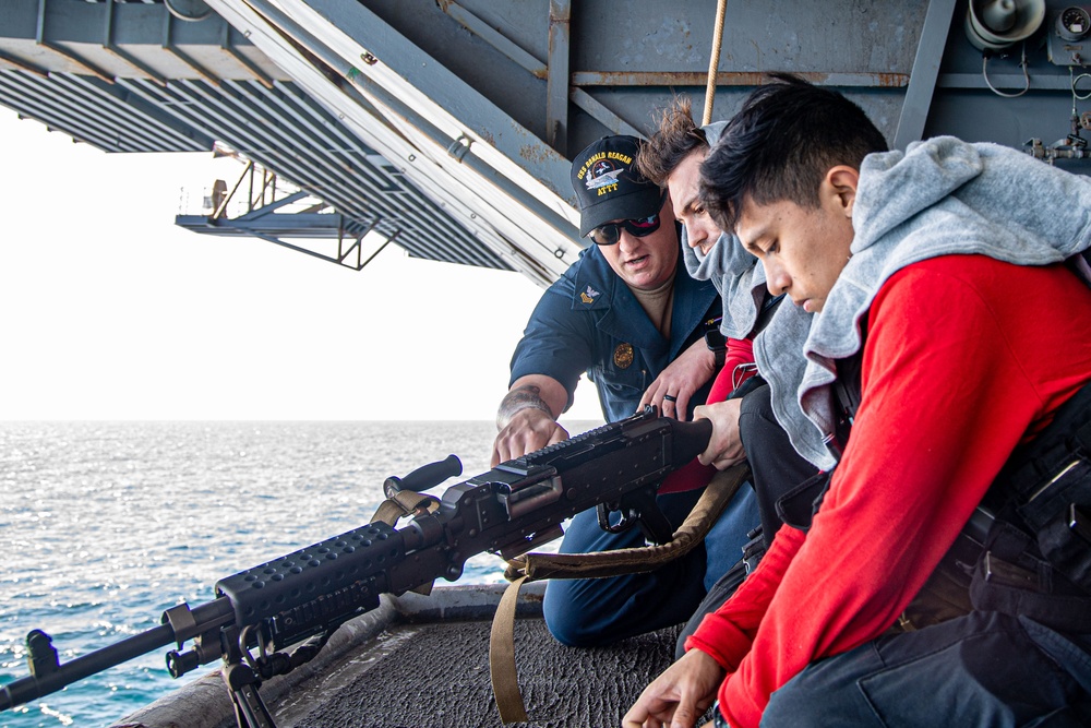 USS Ronald Reagan (CVN 76) Sailors participate in live fire exercise