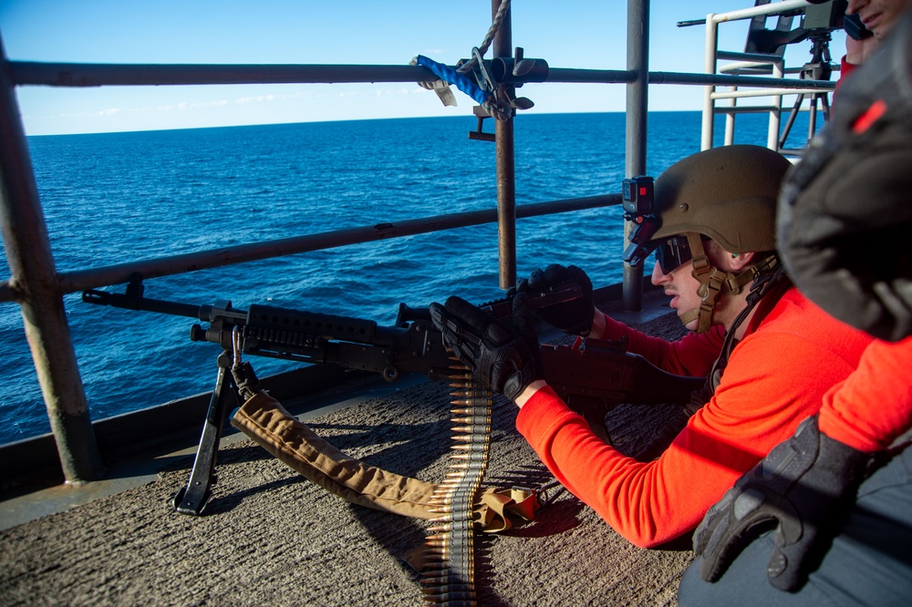 USS Ronald Reagan (CVN 76) Sailors participate in live fire exercise