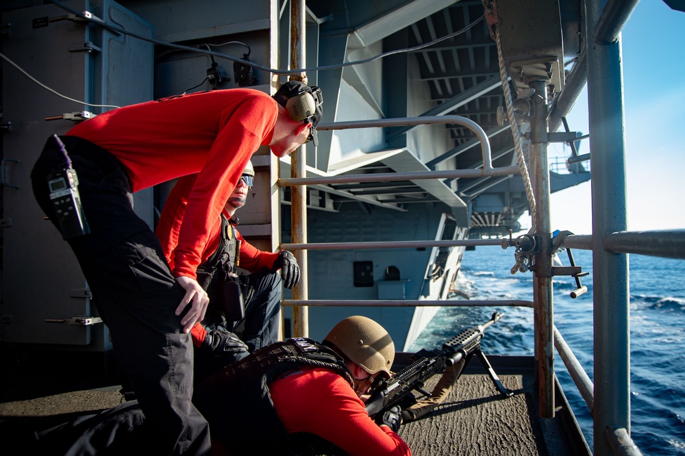 USS Ronald Reagan (CVN 76) Sailors participate in live fire exercise