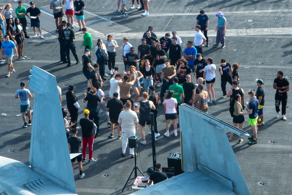 USS Ronald Reagan (CVN 76) holds a steel beach picnic during 20th anniversary of ship’s commissioning