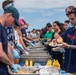 USS Ronald Reagan (CVN 76) holds a steel beach picnic during 20th anniversary of ship’s commissioning