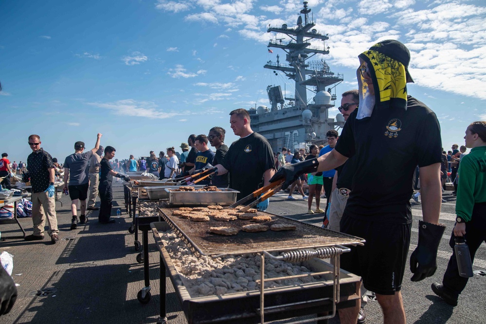 USS Ronald Reagan (CVN 76) holds a steel beach picnic during 20th anniversary of ship’s commissioning