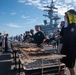 USS Ronald Reagan (CVN 76) holds a steel beach picnic during 20th anniversary of ship’s commissioning