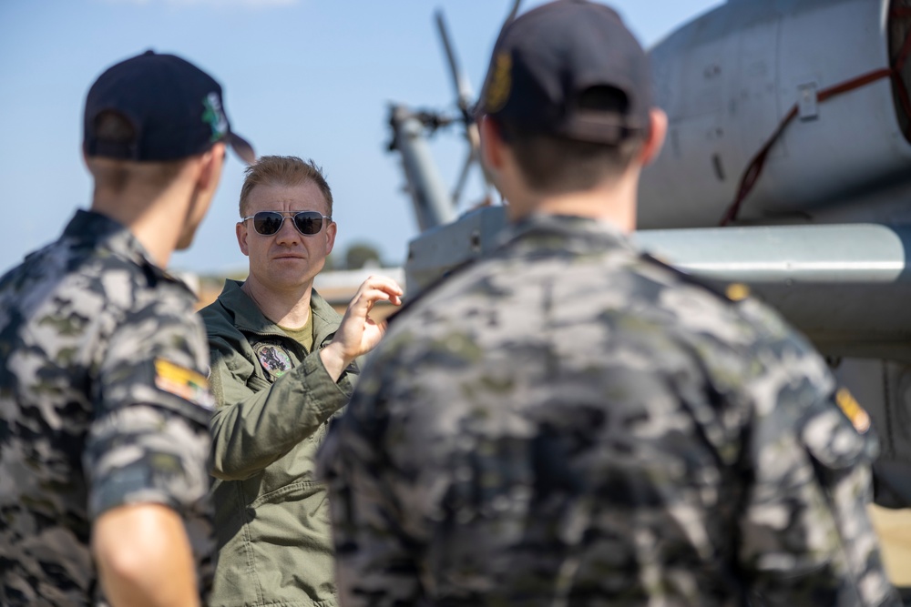 Royal Australian Navy Midshipmen learn about Marine Corps attack helicopters