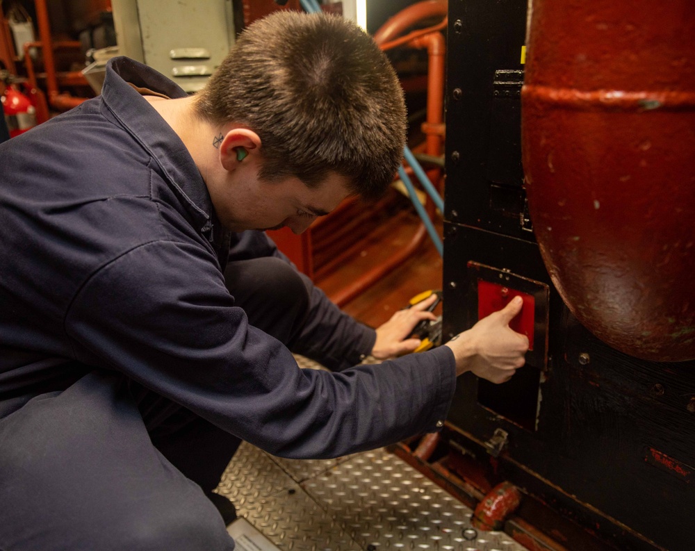 GSM3 Holt Inspects Drain Valve Aboard USS Antietam (CG 54)