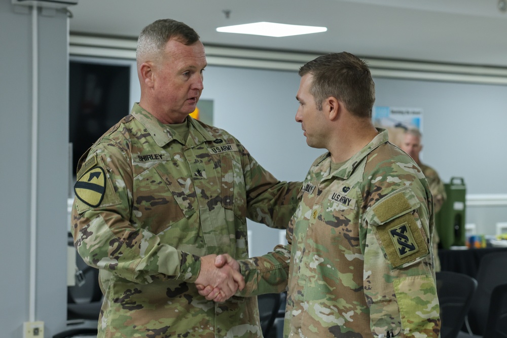 1st TSC commanding general presents commander's coins