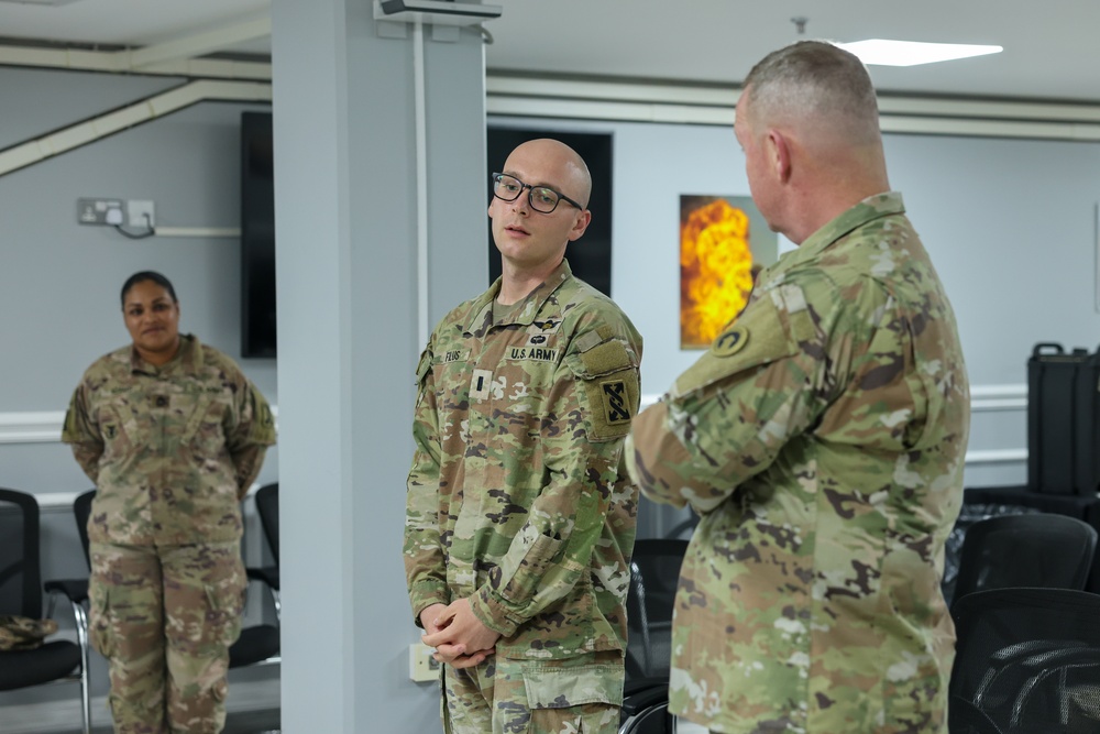 1st TSC commanding general presents commander's coins