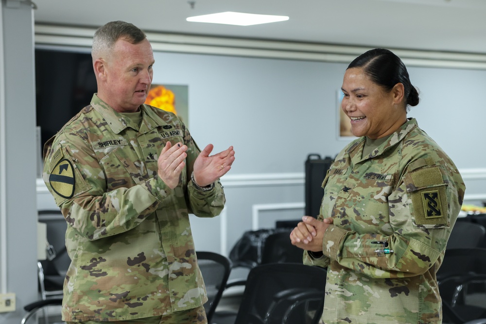 1st TSC commanding general presents commander's coins