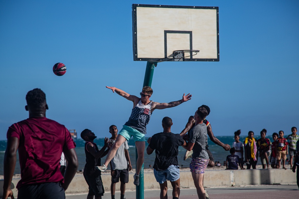 KM23: Sports with local Papuans
