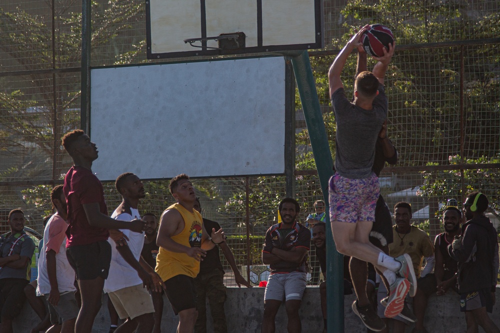 KM23: Sports with local Papuans