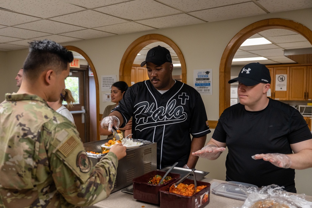 Wolf Pack Chapel, medical Airmen serve homemade meals