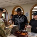 Wolf Pack Chapel, medical Airmen serve homemade meals