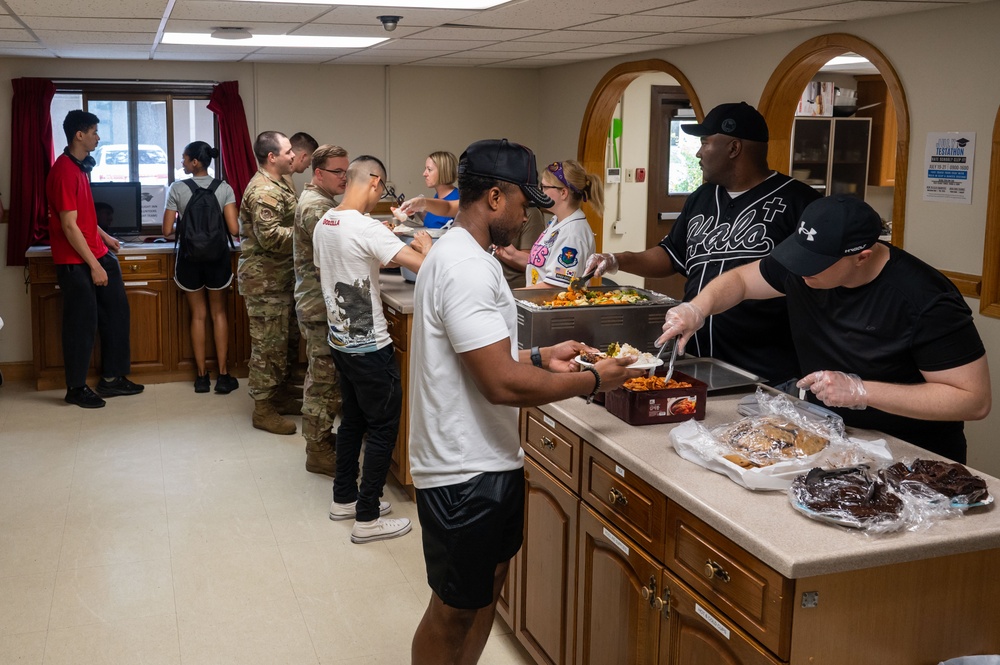 Wolf Pack Chapel, medical Airmen serve homemade meals