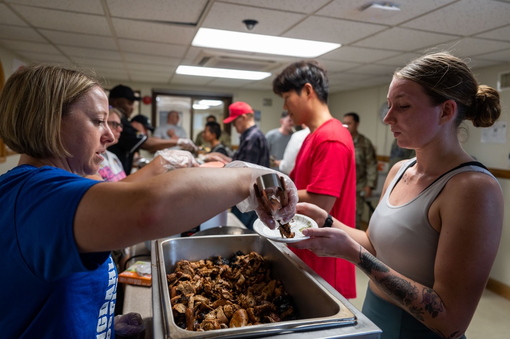 Wolf Pack Chapel, medical Airmen serve homemade meals