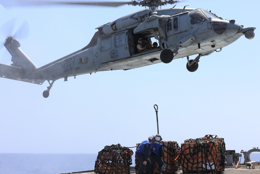 Sailors Attach Creates To Helicopter