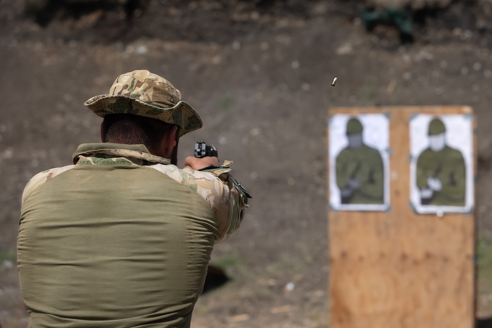 Hungarian soldiers practice firing at pistol range