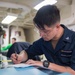 USS Ronald Reagan (CVN 76) Sailors perform daily administration tasks